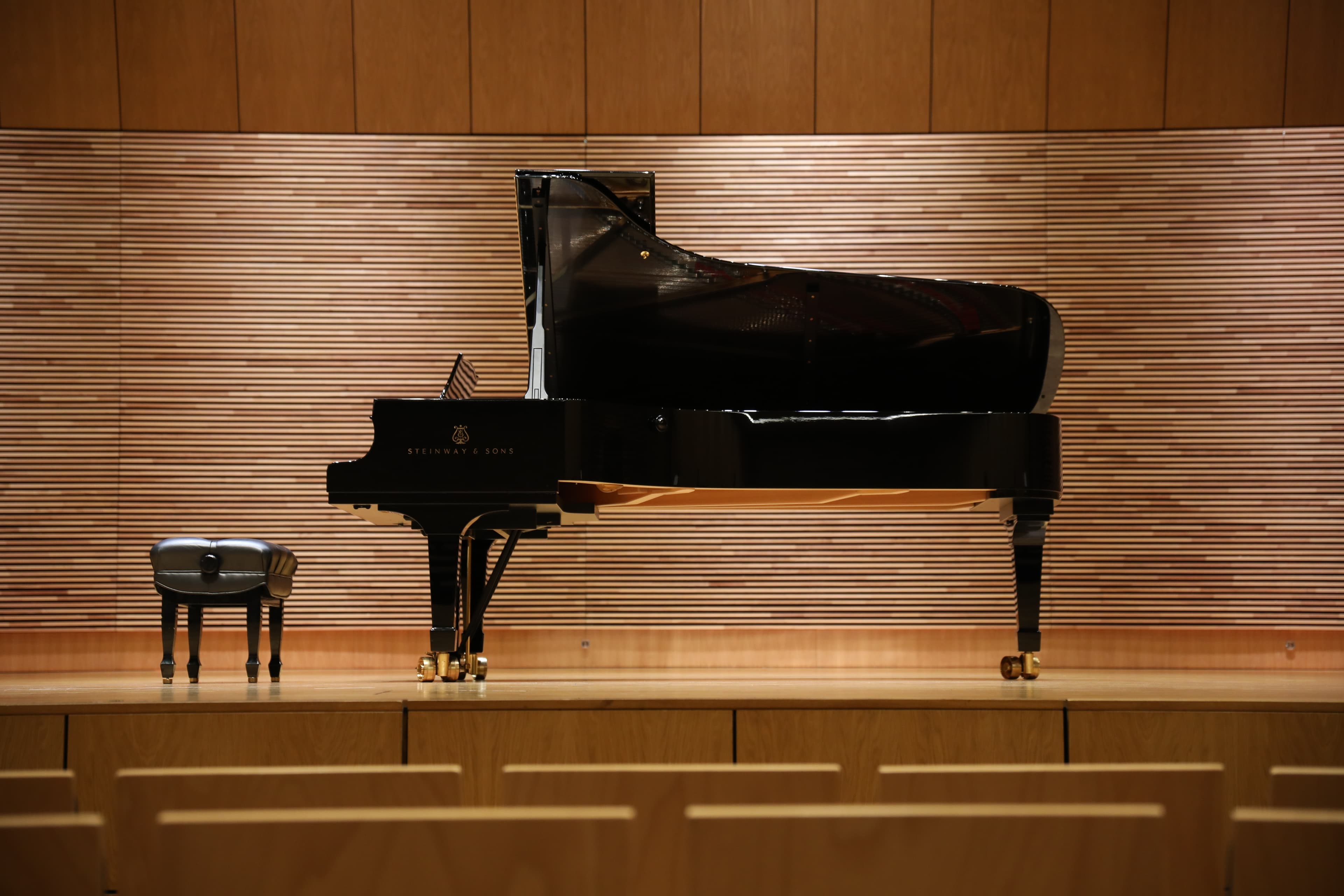 Specialist piano crew handling an instrument in transit prep